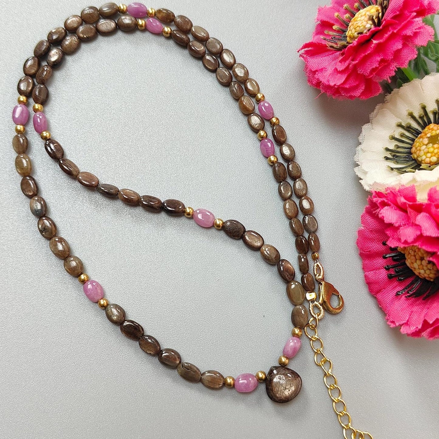 Golden & Pink Sapphire Oval Plain Brass Necklace: 18.04gms Golden & Pink Sapphire Oval Plain Brass Necklace 5*4mm-7*5mm ,10mm 21"( Apx)
