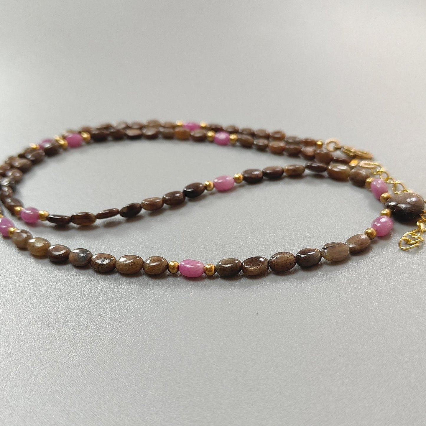 Golden & Pink Sapphire Oval Plain Brass Necklace: 18.04gms Golden & Pink Sapphire Oval Plain Brass Necklace 5*4mm-7*5mm ,10mm 21"( Apx)