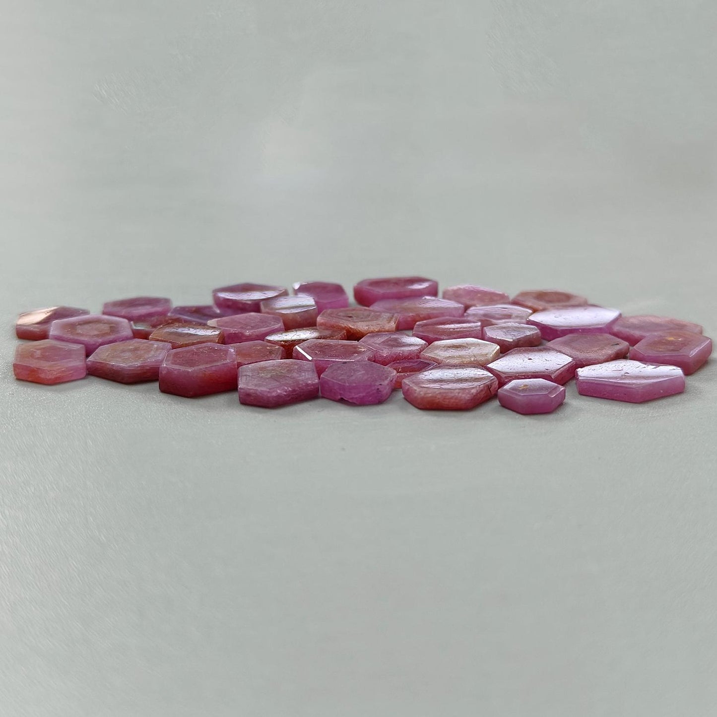 Pink hexagonal tiles on a light gray background