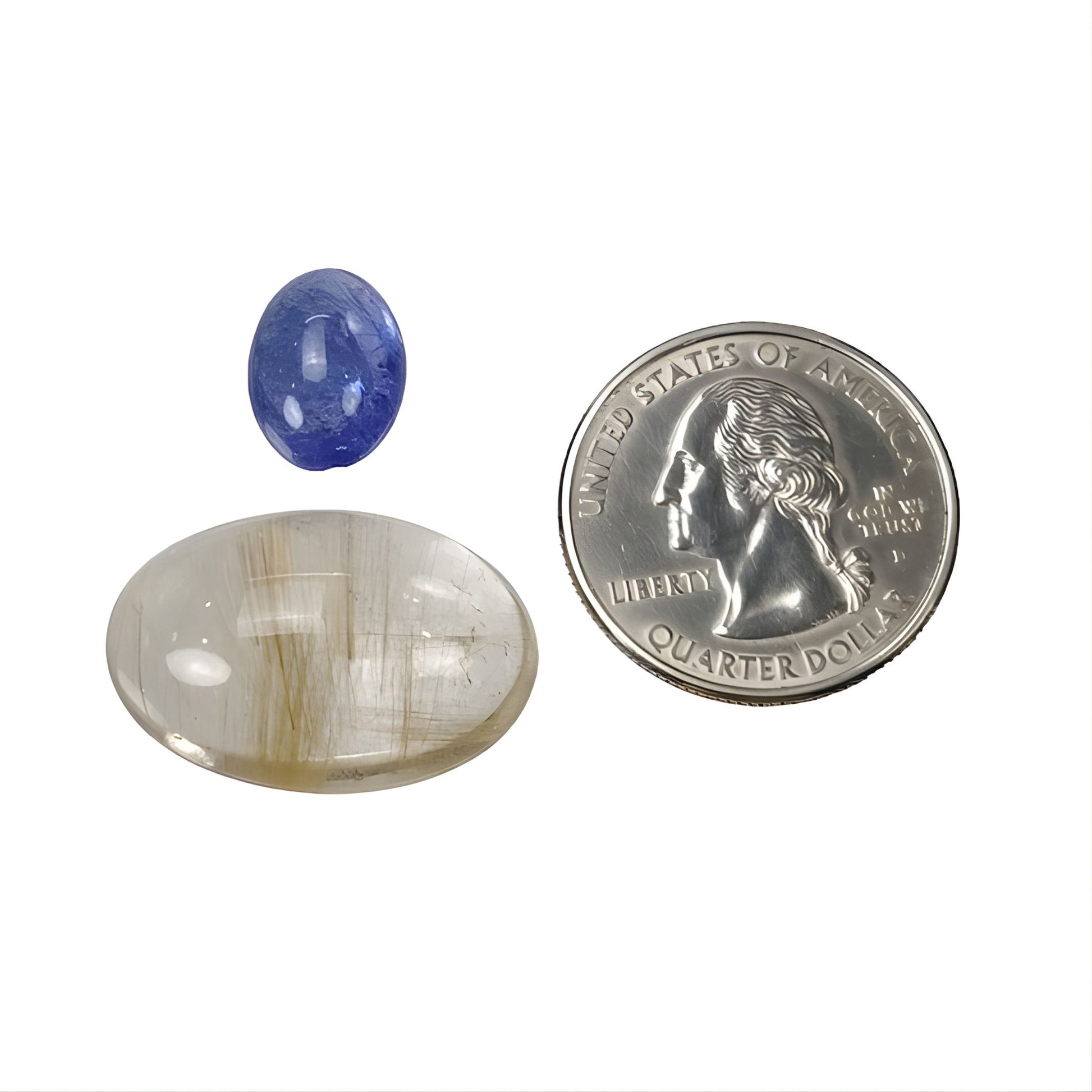 Quarzo rutilato, tanzanite a forma ovale con taglio cabochon.