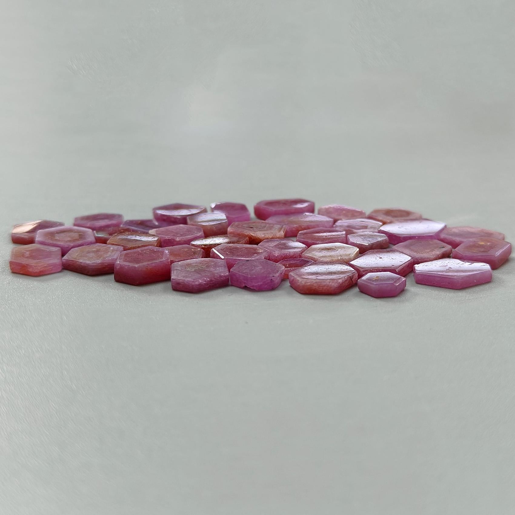 Pink hexagonal tiles on a light gray background